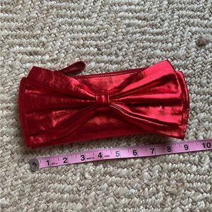 Kate spade red metallic bow clutch